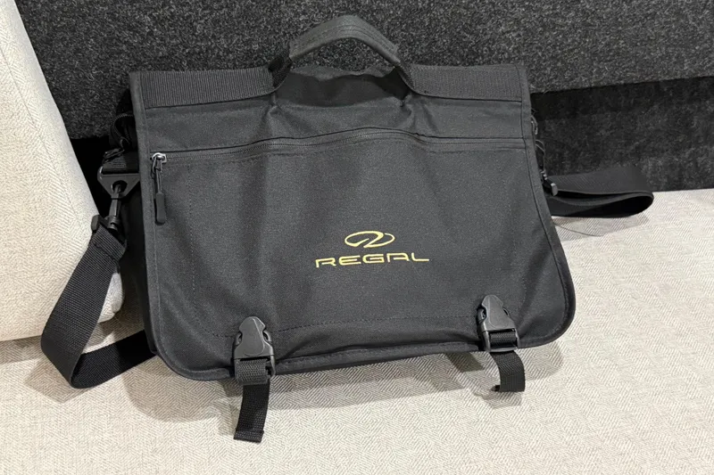 Slide: The Image of Black Regal 26 Express 2021 branded bag with shoulder strap and front pocket. - 45