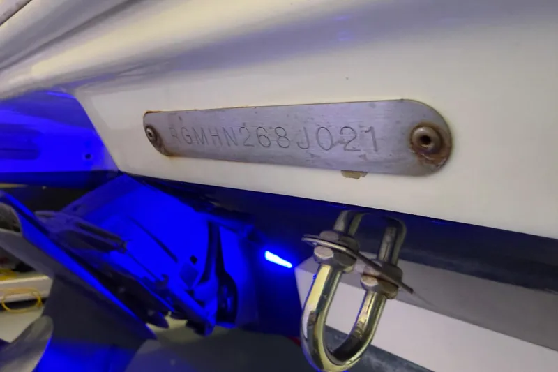 Slide: The Image of 2021 Regal 26 Express boat hull identification number plate with blue lighting. - 50
