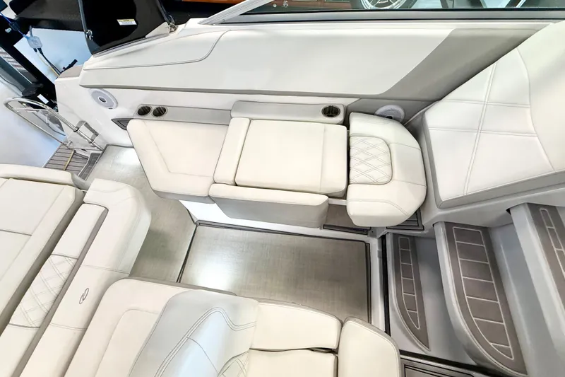 Slide: The Image of 2021 Regal 26 Express boat interior with luxurious white seating and modern design. - 8