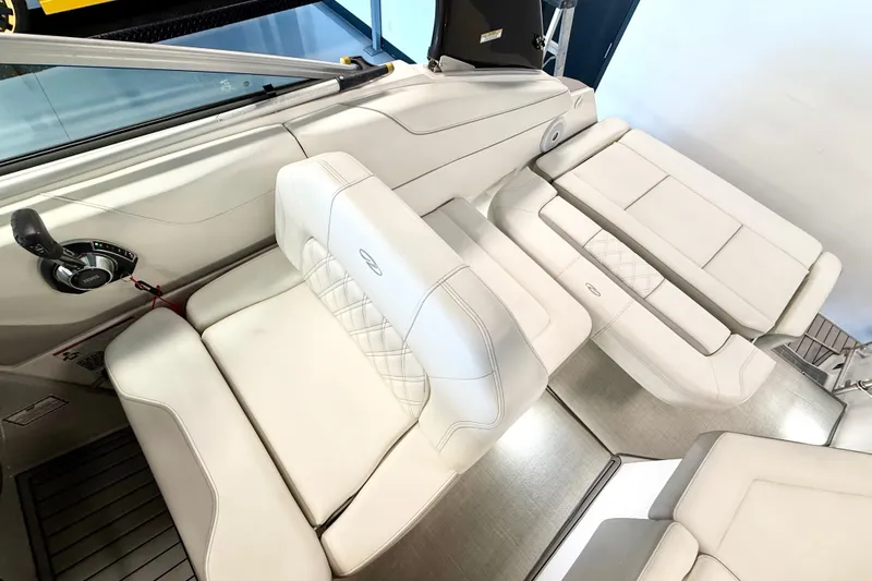 Slide: The Image of 2021 Regal 26 Express boat interior with luxurious white seating. - 9