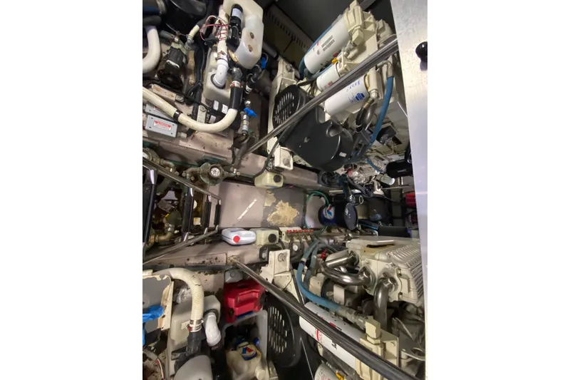 Slide: The Image of Engine room of a 2003 Sea Ray 480 Motor Yacht, showcasing complex machinery and components. - 55
