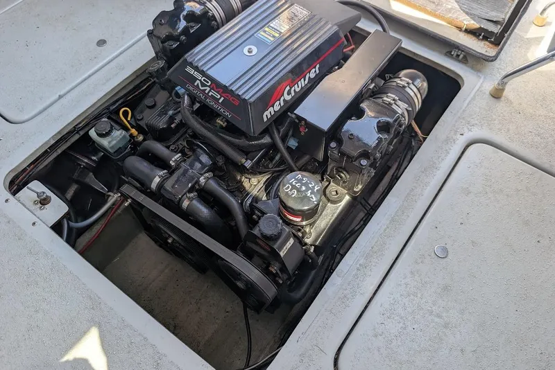 Slide: The Image of Engine compartment of a 1998 Cherokee 270 Sportsman boat with MerCruiser motor. - 28