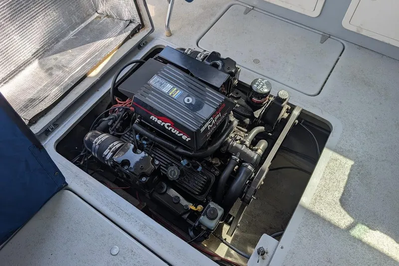 Slide: The Image of Engine compartment of a 1998 Cherokee 270 Sportsman boat with MerCruiser engine. - 29