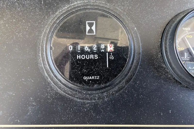 Slide: The Image of Hour meter showing 1628.9 hours on a 1998 Cherokee 270 Sportsman. - 30