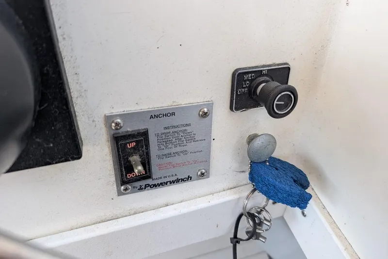 Slide: The Image of Control panel of a 1998 Cherokee 270 Sportsman boat with anchor switch and ignition. - 35
