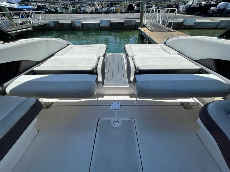 Slide: The Image of 2013 Regal 3200 Bowrider boat interior with spacious seating and sleek design. - 8