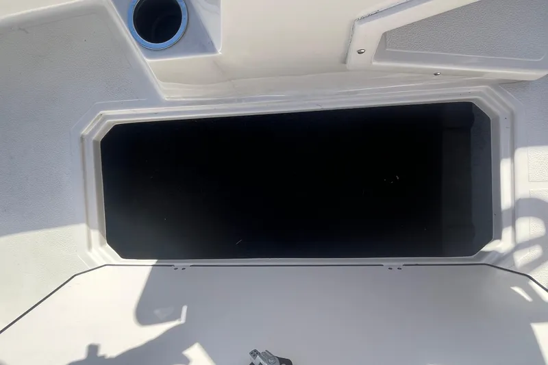 Slide: The Image of Storage compartment on a 2025 Starcraft SVX 171 OB boat, featuring a sleek design. - 12