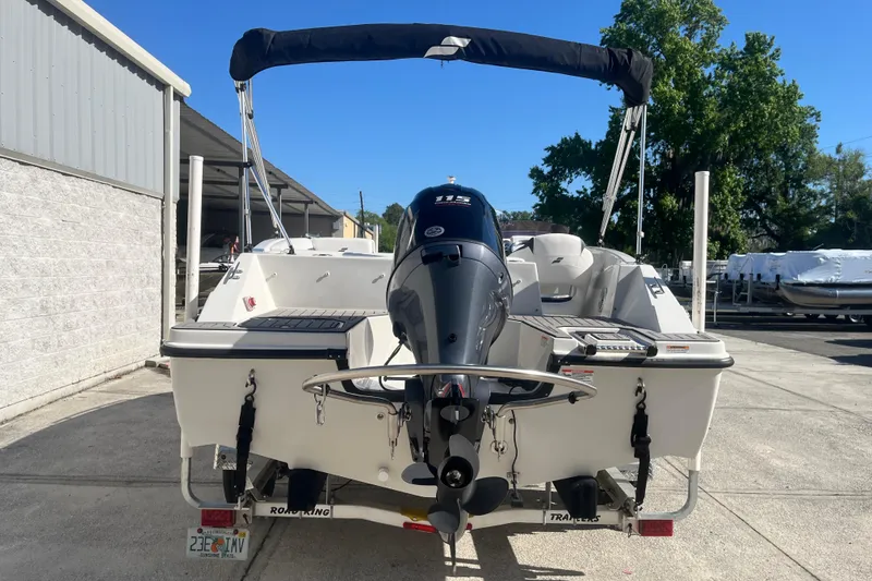 Slide: The Image of 2025 Starcraft SVX 171 OB boat with outboard motor, parked outdoors. - 20