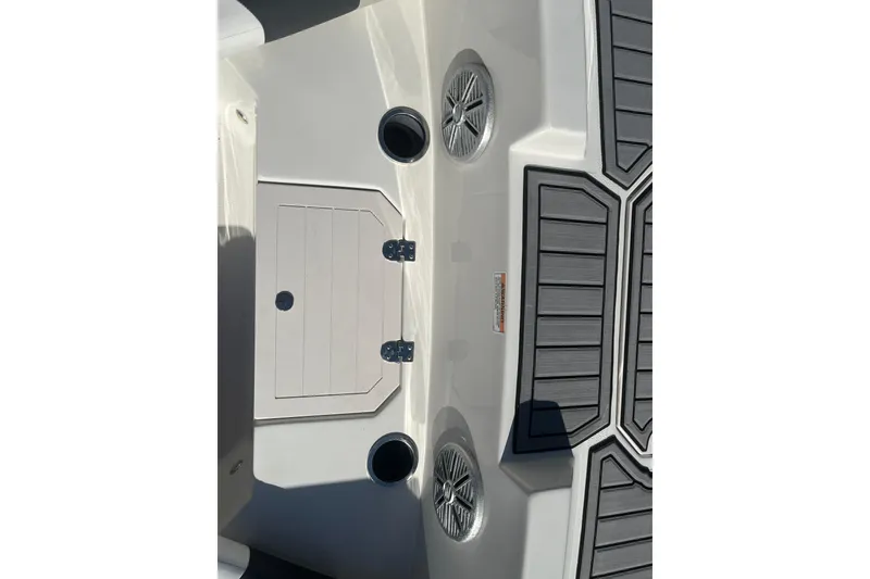 Slide: The Image of 2025 Starcraft SVX 171 OB boat interior with speakers and storage compartment. - 5