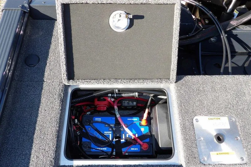 Slide: The Image of Battery compartment of 2026 Lund 2075 Pro-V Bass XS boat, showing wiring and connections. - 10