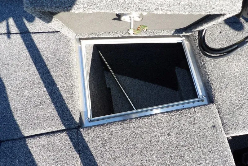 Slide: The Image of Open storage compartment on 2026 Lund 2075 Pro-V Bass XS boat deck. - 40