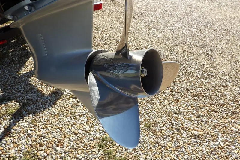 Slide: The Image of Propeller of 2026 Lund 2075 Pro-V Bass XS on gravel surface. - 45