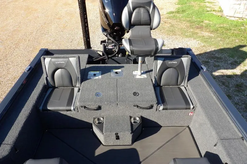 Slide: The Image of 2026 Lund 2075 Pro-V Bass XS boat interior with seating and storage compartments. - 5