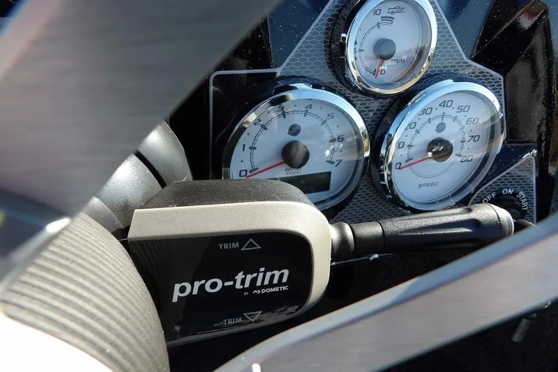 Slide: The Image of Dashboard of 2026 Lund 2075 Pro-V Bass XS with gauges and pro-trim control. - 53