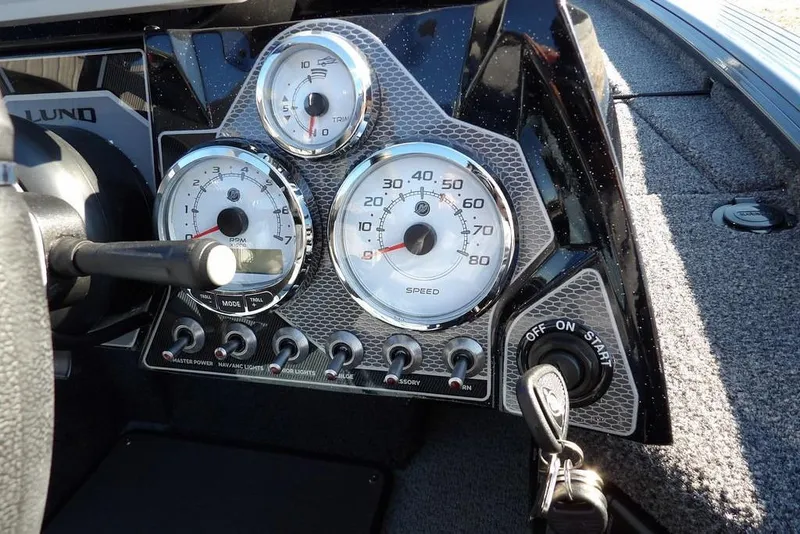 Slide: The Image of Dashboard of 2026 Lund 2075 Pro-V Bass XS boat with gauges and ignition. - 54