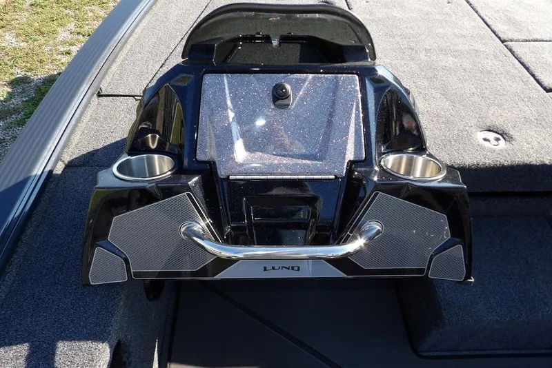 Slide: The Image of 2026 Lund 2075 Pro-V Bass XS boat console with cup holders and sleek design. - 59