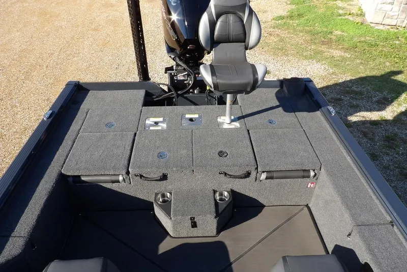 Slide: The Image of 2026 Lund 2075 Pro-V Bass XS boat interior with seating and storage compartments. - 6