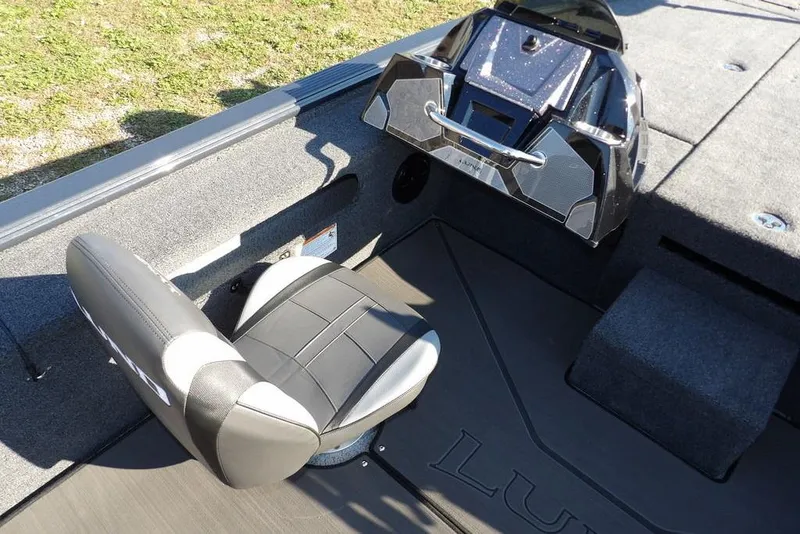 Slide: The Image of 2026 Lund 2075 Pro-V Bass XS boat interior with seating and control panel. - 65