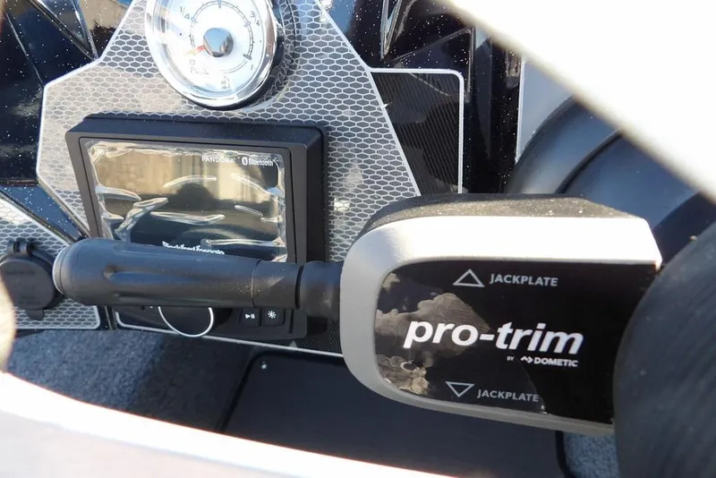 Slide: The Image of Dashboard of 2026 Lund 2075 Pro-V Bass XS with pro-trim control and gauge. - 66