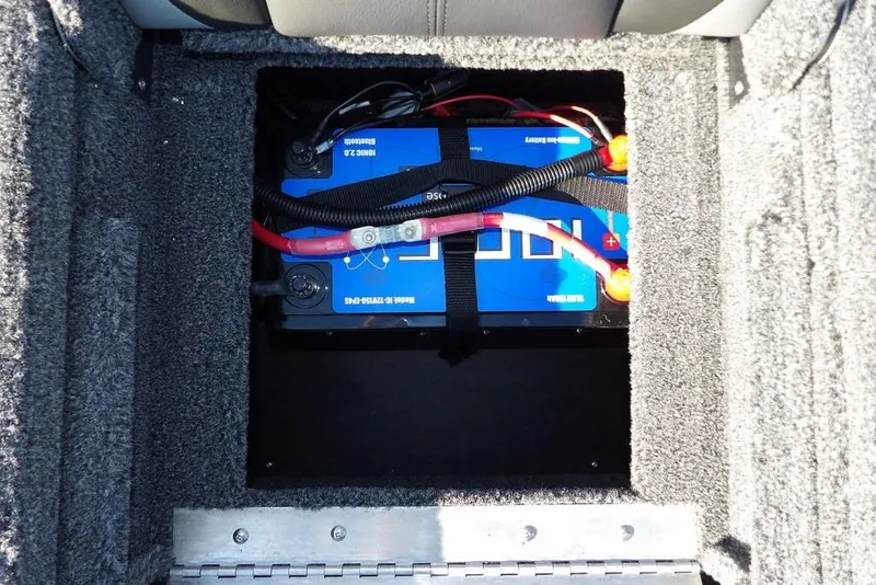 Slide: The Image of Battery compartment of 2026 Lund 2075 Pro-V Bass XS boat, featuring secure wiring. - 7