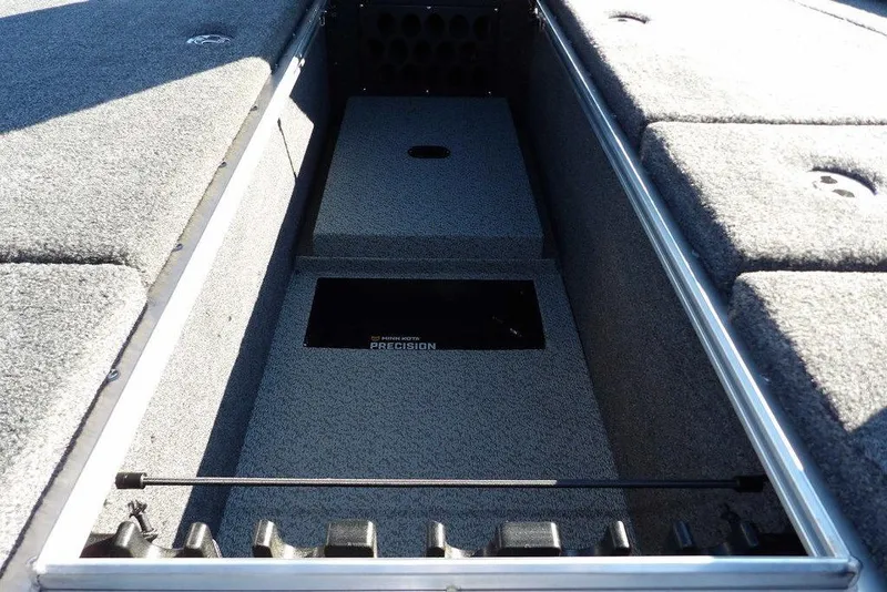 Slide: The Image of Interior view of 2026 Lund 2075 Pro-V Bass XS boat storage compartment. - 74