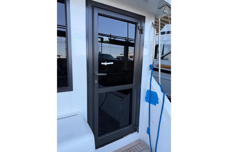 Slide: The Image of Door of 1990 Chris-Craft 392 Commander yacht, featuring sleek design and modern finish. - 11