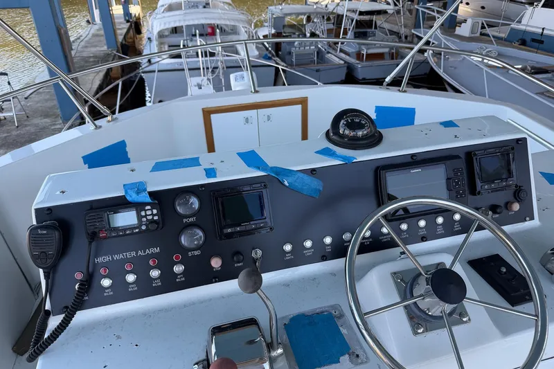 Slide: The Image of Helm of 1990 Chris-Craft 392 Commander with navigation instruments and controls. - 12