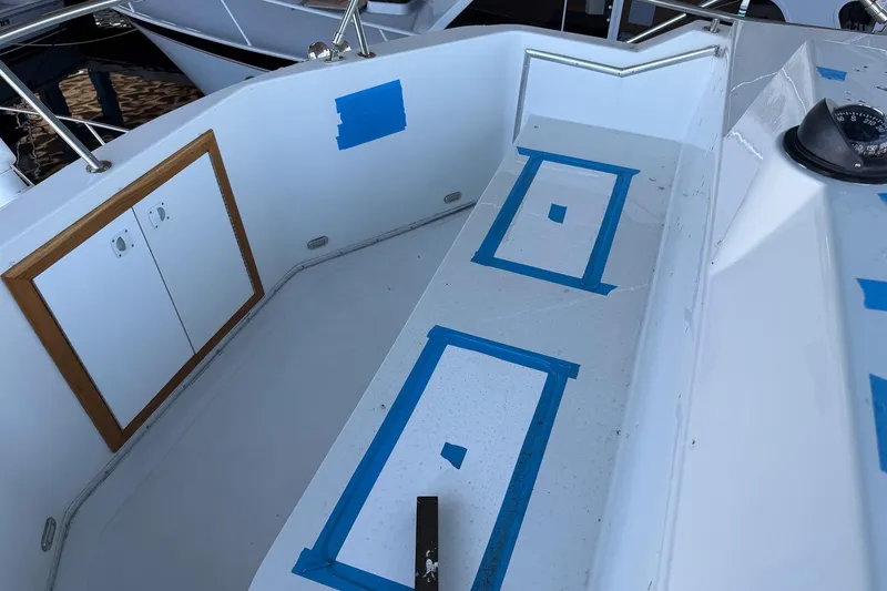 Slide: The Image of 1990 Chris-Craft 392 Commander boat deck with blue tape markings and compass. - 13