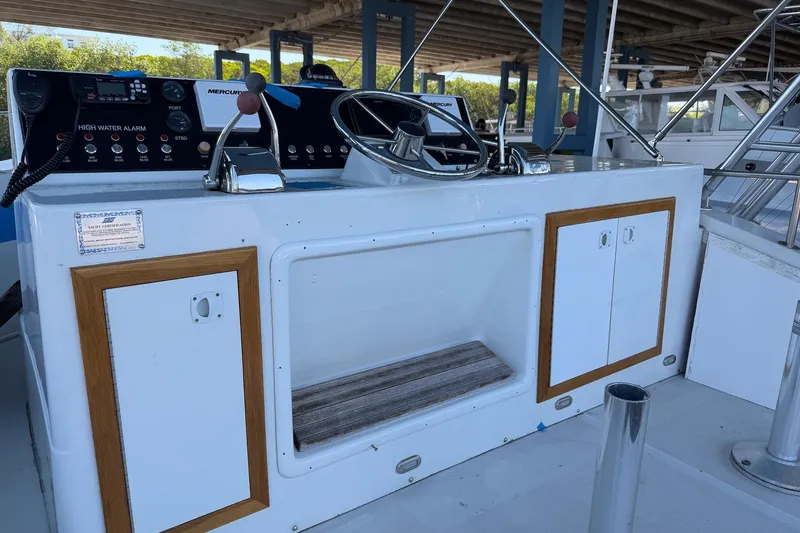 Slide: The Image of Helm of 1990 Chris-Craft 392 Commander with control panel and steering wheel. - 14