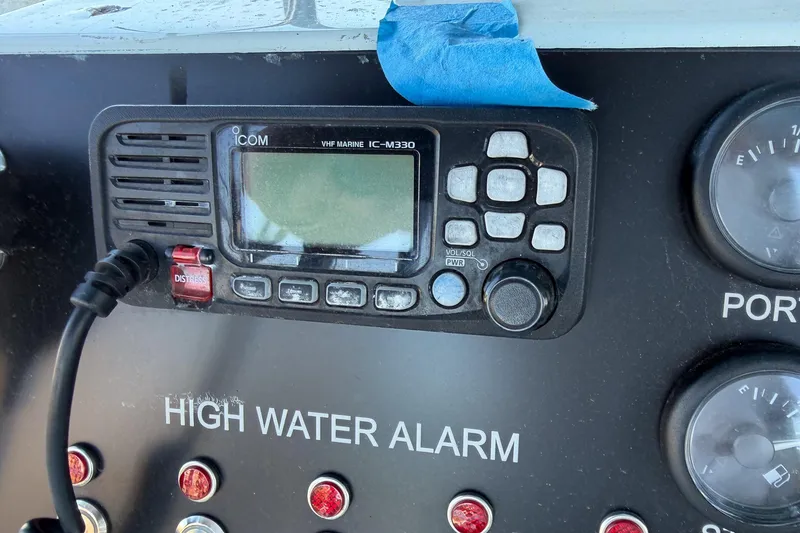Slide: The Image of VHF marine radio and high water alarm on 1990 Chris-Craft 392 Commander dashboard. - 15