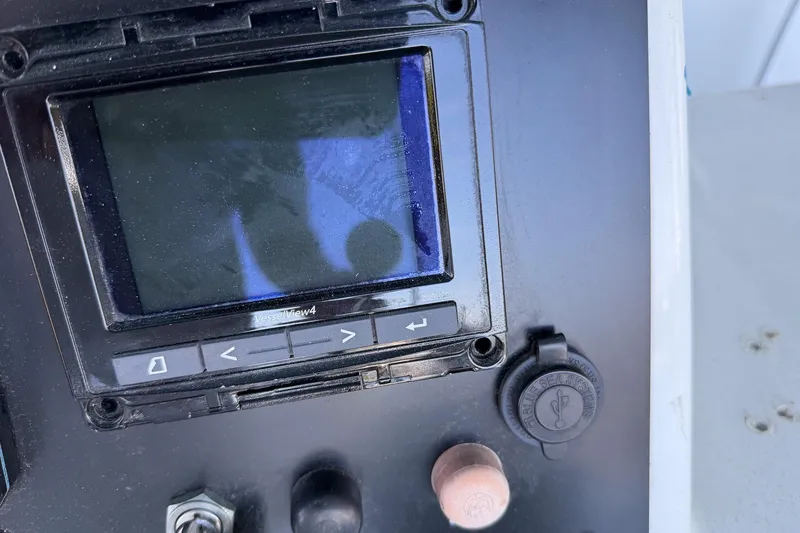 Slide: The Image of Control panel of a 1990 Chris-Craft 392 Commander boat with VesselView4 display. - 16