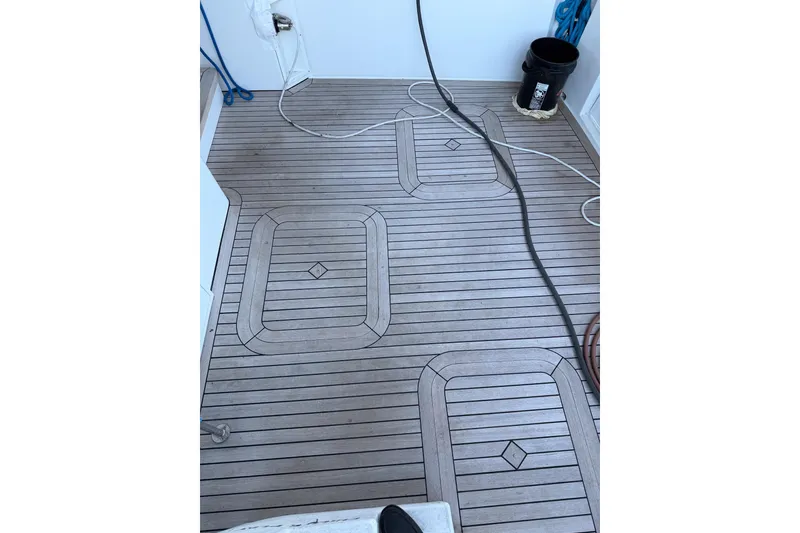 Slide: The Image of 1990 Chris-Craft 392 Commander boat deck with wood pattern and marine equipment. - 18