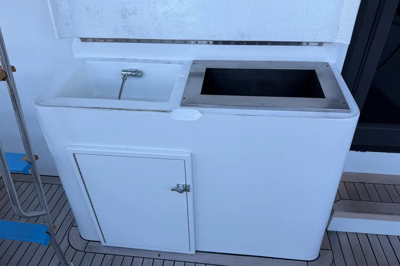 Slide: The Image of Outdoor sink and storage unit on 1990 Chris-Craft 392 Commander yacht deck. - 19