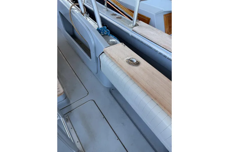 Slide: The Image of 1990 Chris-Craft 392 Commander boat interior with wooden and cushioned seating. - 22