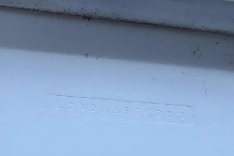 Slide: The Image of Hull identification number on a 1990 Chris-Craft 392 Commander boat. - 25