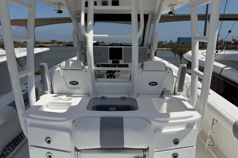 Slide: The Image of 2018 Everglades 355 Center Console boat interior with helm and seating area. - 10