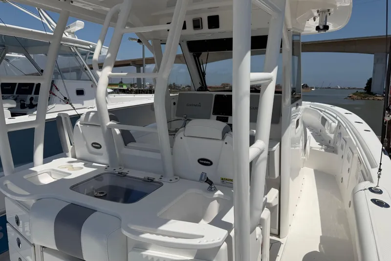 Slide: The Image of 2018 Everglades 355 Center Console boat interior with helm and seating area. - 13