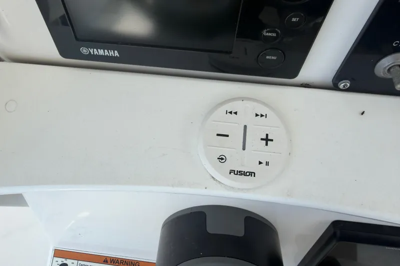 Slide: The Image of Control panel of a 2018 Everglades 355 Center Console boat with Yamaha and Fusion systems. - 34