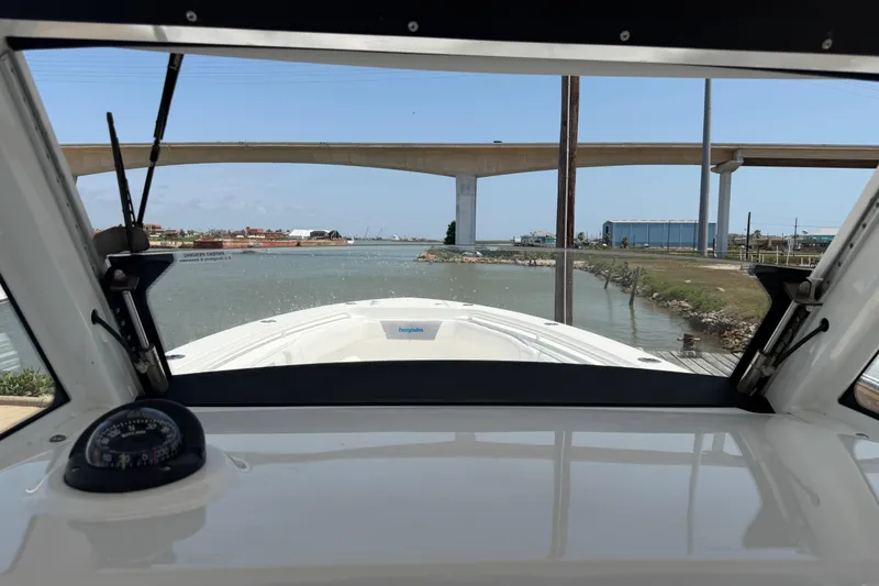 Slide: The Image of View from 2018 Everglades 355 Center Console boat under a bridge on a sunny day. - 36