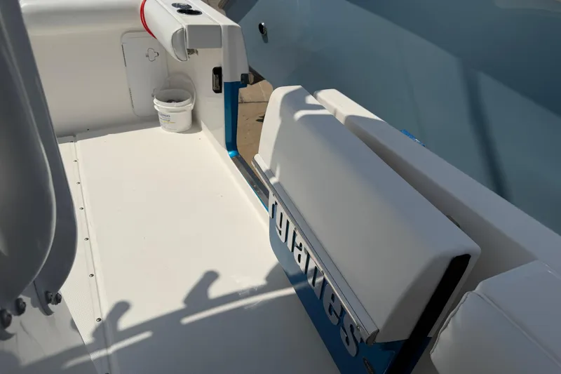 Slide: The Image of 2018 Everglades 355 Center Console boat interior with seating and storage. - 38