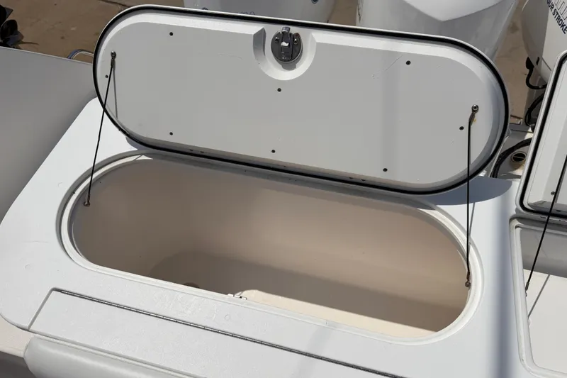 Slide: The Image of Open storage compartment on 2018 Everglades 355 Center Console boat. - 42