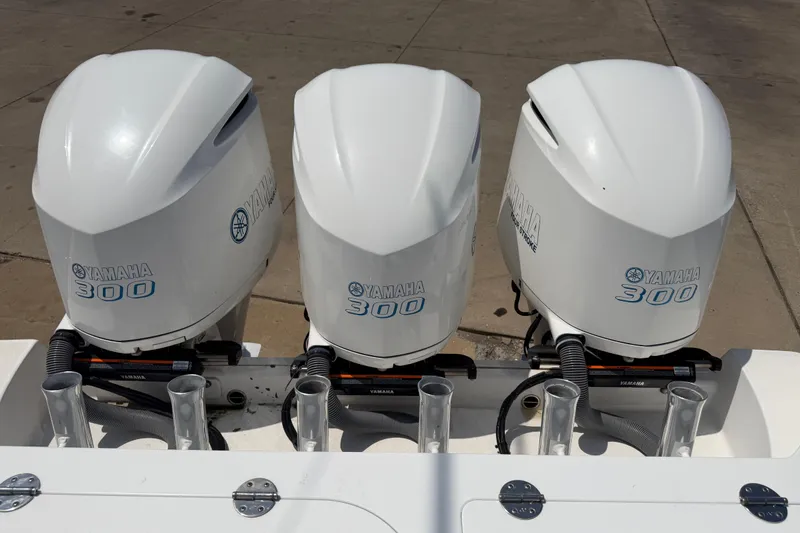 Slide: The Image of Triple Yamaha 300 outboard engines on a 2018 Everglades 355 Center Console boat. - 46