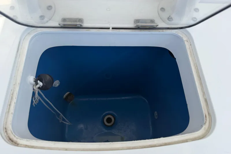 Slide: The Image of Open storage compartment on 2018 Everglades 355 Center Console boat. - 47