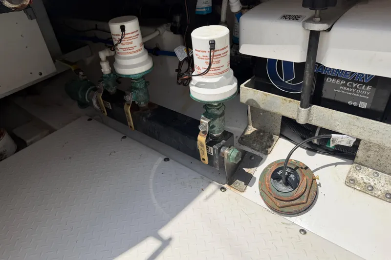 Slide: The Image of Bilge area of 2018 Everglades 355 Center Console with marine equipment and battery. - 48