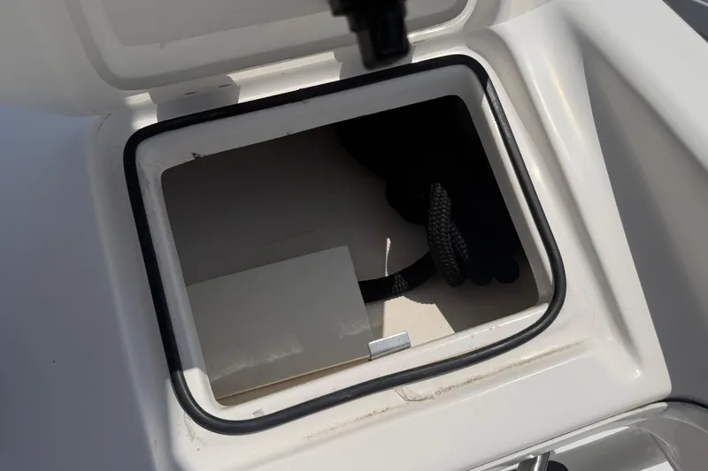 Slide: The Image of Open storage compartment on 2018 Everglades 355 Center Console boat. - 58