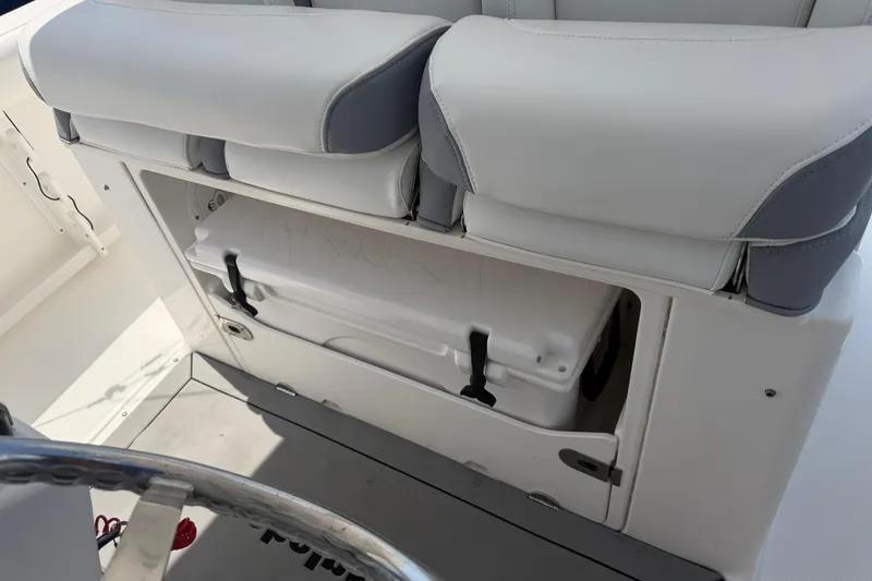 Slide: The Image of 2018 Everglades 355 Center Console boat interior with storage compartment and seating. - 61