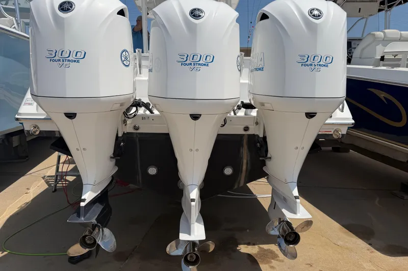 Slide: The Image of Triple Yamaha 300 V6 outboard engines on a 2018 Everglades 355 Center Console boat. - 64