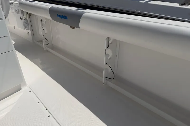 Slide: The Image of 2018 Everglades 355 Center Console boat interior with rod holders and storage. - 65