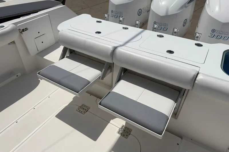 Slide: The Image of 2018 Everglades 355 Center Console boat with foldable seating and Yamaha 300 engines. - 66
