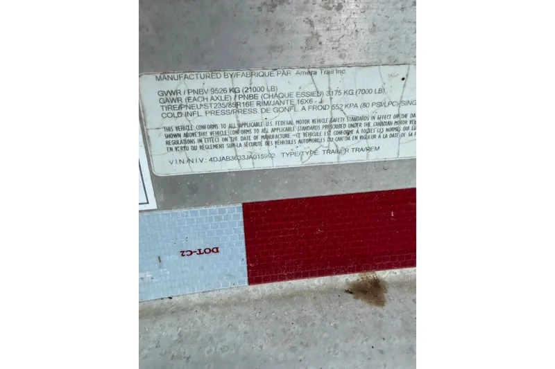 Slide: The Image of Label on Everglades 355 Center Console 2018, displaying vehicle specifications and safety standards. - 74